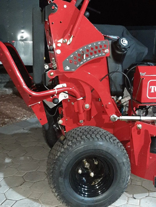 GrassFlap™ brand chute blocker mounted on Toro GrandStand stand-on mower, designed for hands-free operation of the chute blocker.