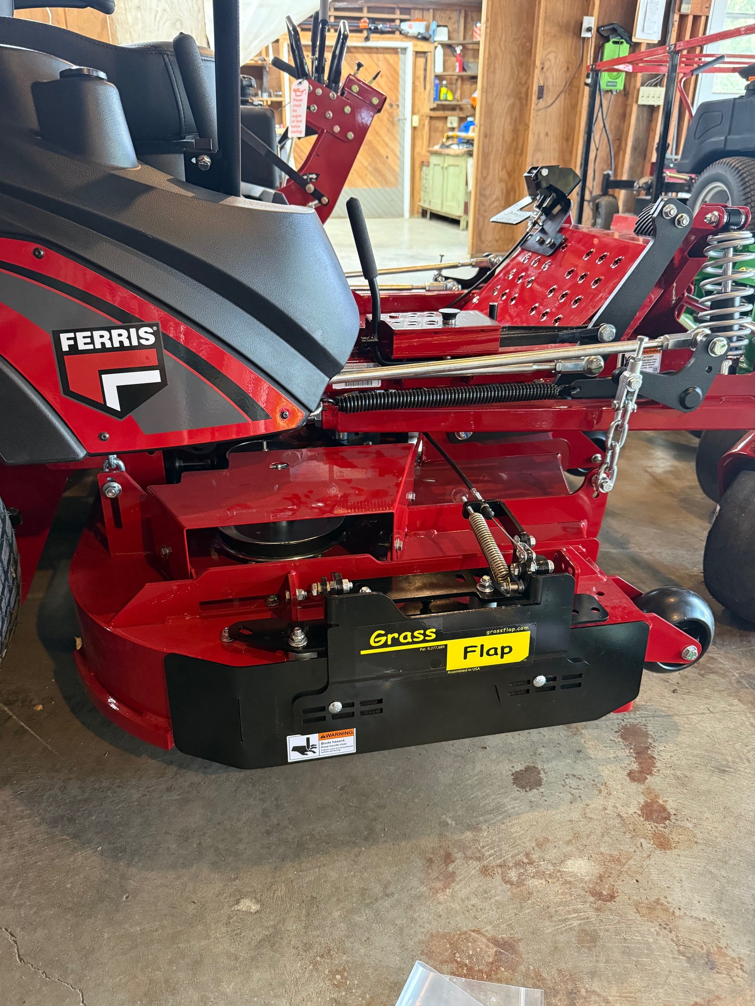Ferris mower showing the front of the GrassFlap™ chute blocker on the side discharge chute.